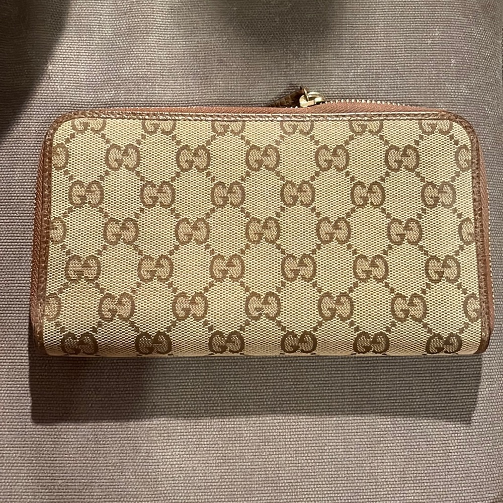 Gucci tobacco canvas zip around wallet. Very Good condition.